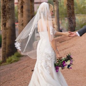 Beautiful wedding dress, veil and slip… worn once.